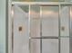 The bathroom features a modern shower with sliding glass doors and gold fixtures at 112 Edmondson Dr, Willow Springs, NC 27592