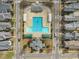 Overhead shot showcasing neighborhood recreational amenities including a pool, tennis courts, and a park at 115 White Lake Ct, Cary, NC 27519