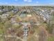 An aerial view of the community showcasing its amenities: a playground, tennis court, and gazebo at 115 White Lake Ct, Cary, NC 27519