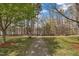 Beautiful backyard with a walking path and water view from the home, perfect for outdoor enjoyment at 115 White Lake Ct, Cary, NC 27519