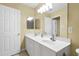 This bathroom has a double vanity with ample counter space and a door to the toilet at 115 White Lake Ct, Cary, NC 27519