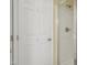 This bathroom has a clean shower with a glass door, and a white paneled door next to it at 115 White Lake Ct, Cary, NC 27519
