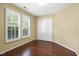 Bedroom features hardwood floors, plantation shutters and closet at 115 White Lake Ct, Cary, NC 27519