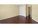 Bedroom features hardwood floors, closet and adjacent room access at 115 White Lake Ct, Cary, NC 27519