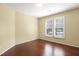 Bedroom with hardwood floors and plantation shutters offers ample natural light at 115 White Lake Ct, Cary, NC 27519