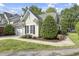This home has an attractive exterior with well-maintained greenery and a neat lawn at 115 White Lake Ct, Cary, NC 27519
