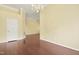 Spacious living area featuring beautiful hardwood floors and neutral color scheme at 115 White Lake Ct, Cary, NC 27519