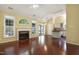 Open concept living area with fireplace flowing into the bright kitchen at 115 White Lake Ct, Cary, NC 27519