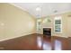 Bright living room with vaulted ceilings, hardwood floors, fireplace, and ample natural light at 115 White Lake Ct, Cary, NC 27519