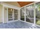 The screened-in patio is accessed via sliding doors, featuring tile flooring at 115 White Lake Ct, Cary, NC 27519