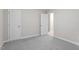 Bedroom features neutral gray walls, gray carpet, and white doors at 1205 Freeman Dr, Sanford, NC 27330
