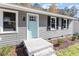Home with horizontal siding, light blue front door and well-manicured landscaping at 1205 Freeman Dr, Sanford, NC 27330