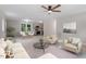 Open-concept living space flowing into dining and kitchen, featuring modern furnishings and natural light at 1205 Freeman Dr, Sanford, NC 27330
