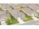 Overhead shot of single-Gathering houses in a planned community with uniform landscaping at 122 Tall Timber Dr, Gibsonville, NC 27249