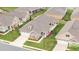 Aerial view of single-story homes in a neighborhood with manicured lawns and coordinated exteriors at 122 Tall Timber Dr, Gibsonville, NC 27249
