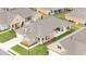 Aerial view showcasing the well-maintained roofs and lawns of houses in a vibrant neighborhood at 122 Tall Timber Dr, Gibsonville, NC 27249