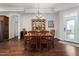Traditional dining room featuring a wood table and chairs set, chandelier, and glass door leading to a patio at 122 Tall Timber Dr, Gibsonville, NC 27249