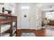 Foyer featuring hardwood floors, antique cabinet and glass doors leading into another room at 122 Tall Timber Dr, Gibsonville, NC 27249