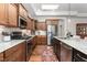 The kitchen has wooden cabinets, stainless steel appliances, and a sink with granite countertops at 122 Tall Timber Dr, Gibsonville, NC 27249