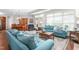 Open-concept living room with dining area, lots of seating, and hardwood floors at 122 Tall Timber Dr, Gibsonville, NC 27249