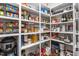 Spacious walk-in pantry with ample shelving for organized storage of food and small appliances at 122 Tall Timber Dr, Gibsonville, NC 27249