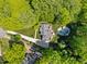 Beautiful aerial view of the house, set in a verdant neighborhood with a pool and long driveway at 12200 Glenlivet Way, Raleigh, NC 27613