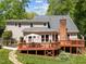 Expansive backyard view featuring a well-kept lawn, and a multi-tiered deck, great for entertaining guests at 12200 Glenlivet Way, Raleigh, NC 27613