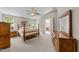 Bedroom with carpet, ceiling fan, and multiple furnishings at 12200 Glenlivet Way, Raleigh, NC 27613