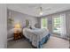 Comfortable bedroom with neutral carpet, ceiling fan, and natural light from two windows at 12200 Glenlivet Way, Raleigh, NC 27613