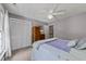 Bedroom with a ceiling fan, a view into the hall and a view of the en-suite bathroom at 12200 Glenlivet Way, Raleigh, NC 27613