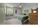 Cozy bedroom featuring a built-in window seat, ceiling fan, and warm, inviting décor at 12200 Glenlivet Way, Raleigh, NC 27613