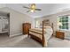 Bedroom with carpet, ceiling fan, and multiple furnishings at 12200 Glenlivet Way, Raleigh, NC 27613