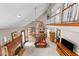 Spacious living room with vaulted ceilings, brick fireplace, and open floor plan at 12200 Glenlivet Way, Raleigh, NC 27613