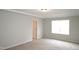 Comfortable bedroom featuring neutral tones, carpeting, and abundant natural light at 123 Hunston Dr, Holly Springs, NC 27540