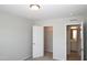 Bedroom view featuring closet and bathroom entrances and neutral color palette at 123 Hunston Dr, Holly Springs, NC 27540