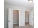 Bedroom view featuring closet and bathroom entrances with closet door open at 123 Hunston Dr, Holly Springs, NC 27540