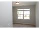 Bedroom features a window to let in natural light and neutral carpeting at 123 Hunston Dr, Holly Springs, NC 27540