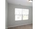 Bright bedroom with natural light showcasing a large window and neutral color palette at 123 Hunston Dr, Holly Springs, NC 27540