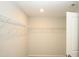 Walk-in closet with white wire shelving providing ample storage space at 123 Hunston Dr, Holly Springs, NC 27540