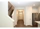 Inviting entryway featuring staircase, wood floors, and modern lighting at 123 Hunston Dr, Holly Springs, NC 27540