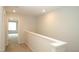 Upstairs hallway featuring neutral walls at 123 Hunston Dr, Holly Springs, NC 27540