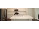 Modern kitchen with a center island, stainless appliances, and white cabinetry at 123 Hunston Dr, Holly Springs, NC 27540