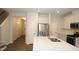 Modern kitchen with stainless steel appliances, center island and sleek design elements at 123 Hunston Dr, Holly Springs, NC 27540