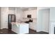 Bright kitchen featuring stainless appliances, a center island, and white cabinets at 123 Hunston Dr, Holly Springs, NC 27540