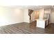 Inviting living room area with hardwood floors, and access to the kitchen at 123 Hunston Dr, Holly Springs, NC 27540