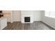 Hardwood floors in the living room with fireplace at 123 Hunston Dr, Holly Springs, NC 27540