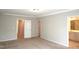 Bright main bedroom with multiple doors and an ensuite bathroom with a marble countertop at 123 Hunston Dr, Holly Springs, NC 27540