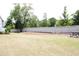 Community open space with picnic tables and a white fence at 123 Hunston Dr, Holly Springs, NC 27540