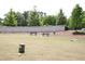 Community picnic area featuring multiple tables, grill and a white fence at 123 Hunston Dr, Holly Springs, NC 27540