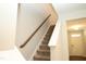Carpeted staircase leading to upper level of home at 123 Hunston Dr, Holly Springs, NC 27540